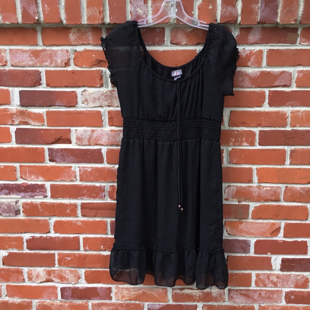 Black midi dress. Sheer sleeves.
